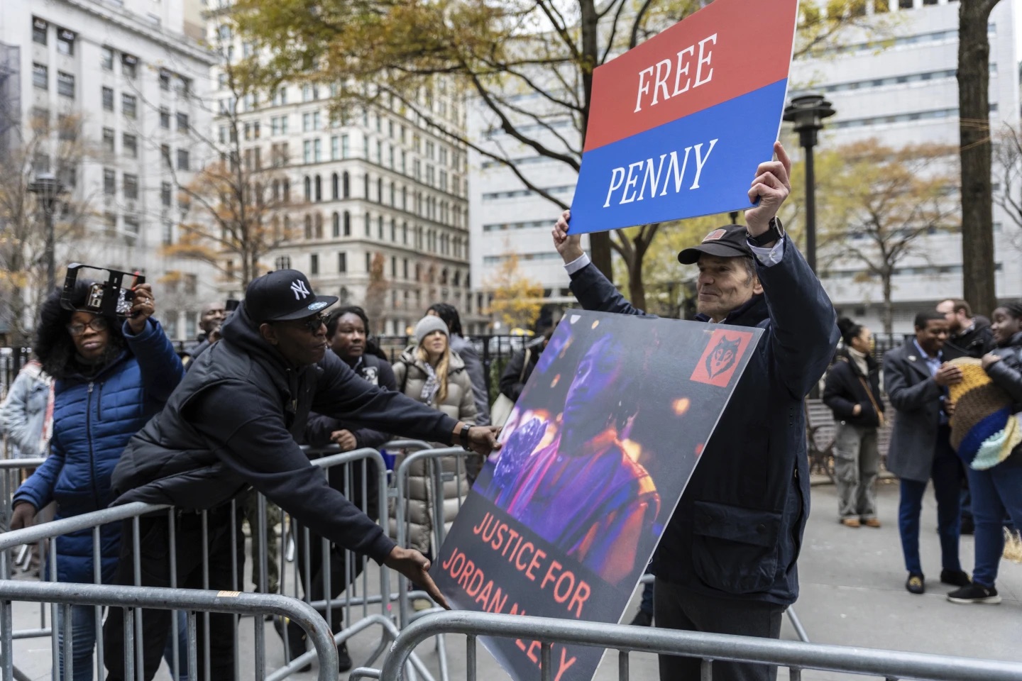 Rival protesters for the Daniel Penny trial gather outside criminal court in New York City on Monday.