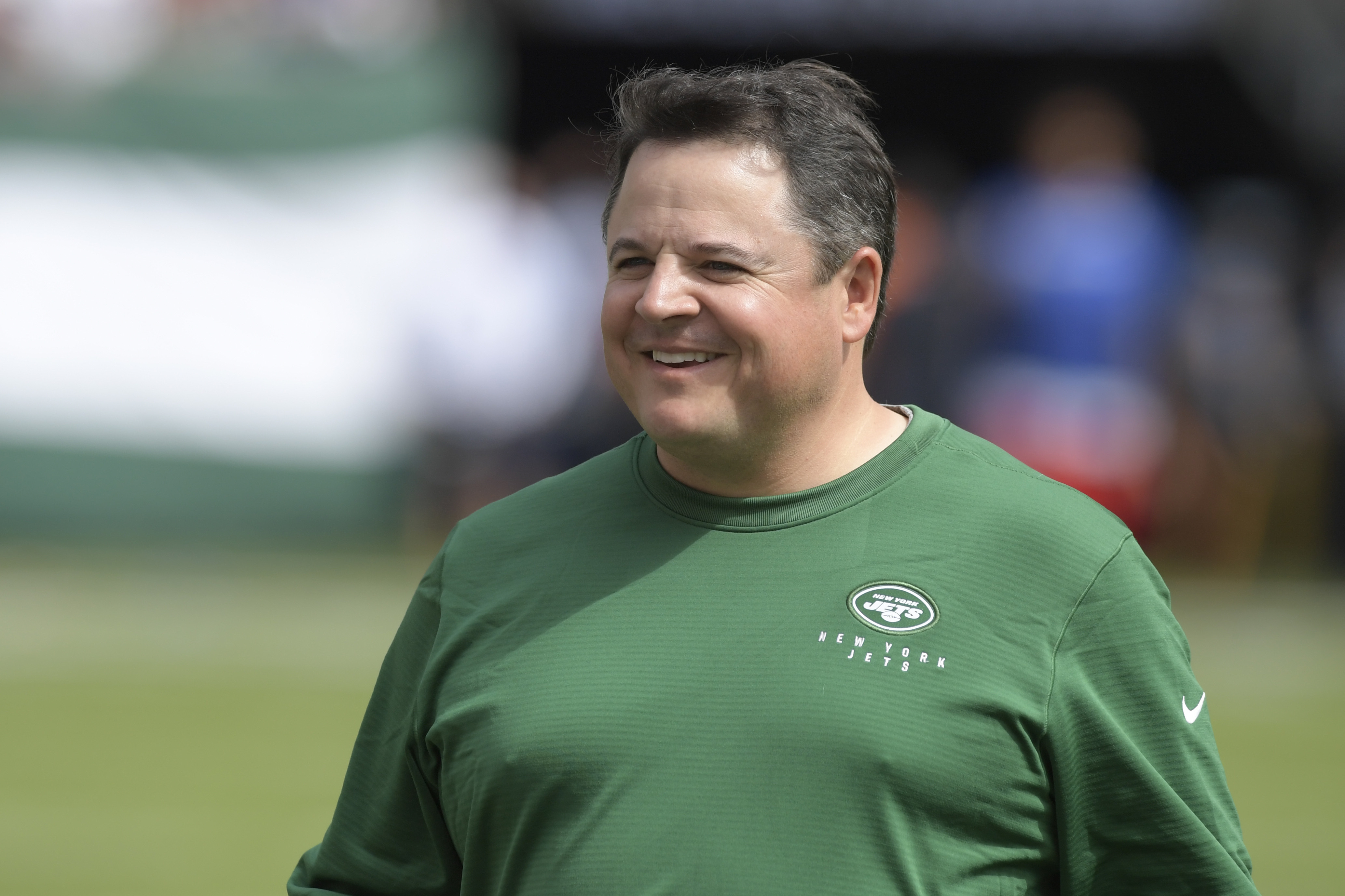 FILE - Then-New York Jets offensive coordinator Dowell Loggains smiles before an NFL football game against the Buffalo Bills, Sunday, Sept. 8, 2019, in East Rutherford, N.J.
