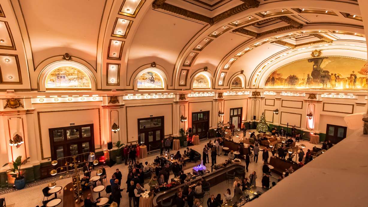 People move around the inside of the lobby of the Asher Adams during an open house event at the Salt Lake City hotel on Thursday. The hotel, which partially uses the historic Union Pacific Railroad Station, opened last month.