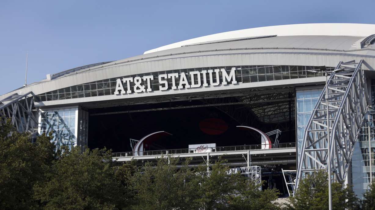 FILE - The outside of AT&T Stadium is shown with the end zone doors open before an NFL football game between in Arlington, Texas, Oct. 4, 2020.