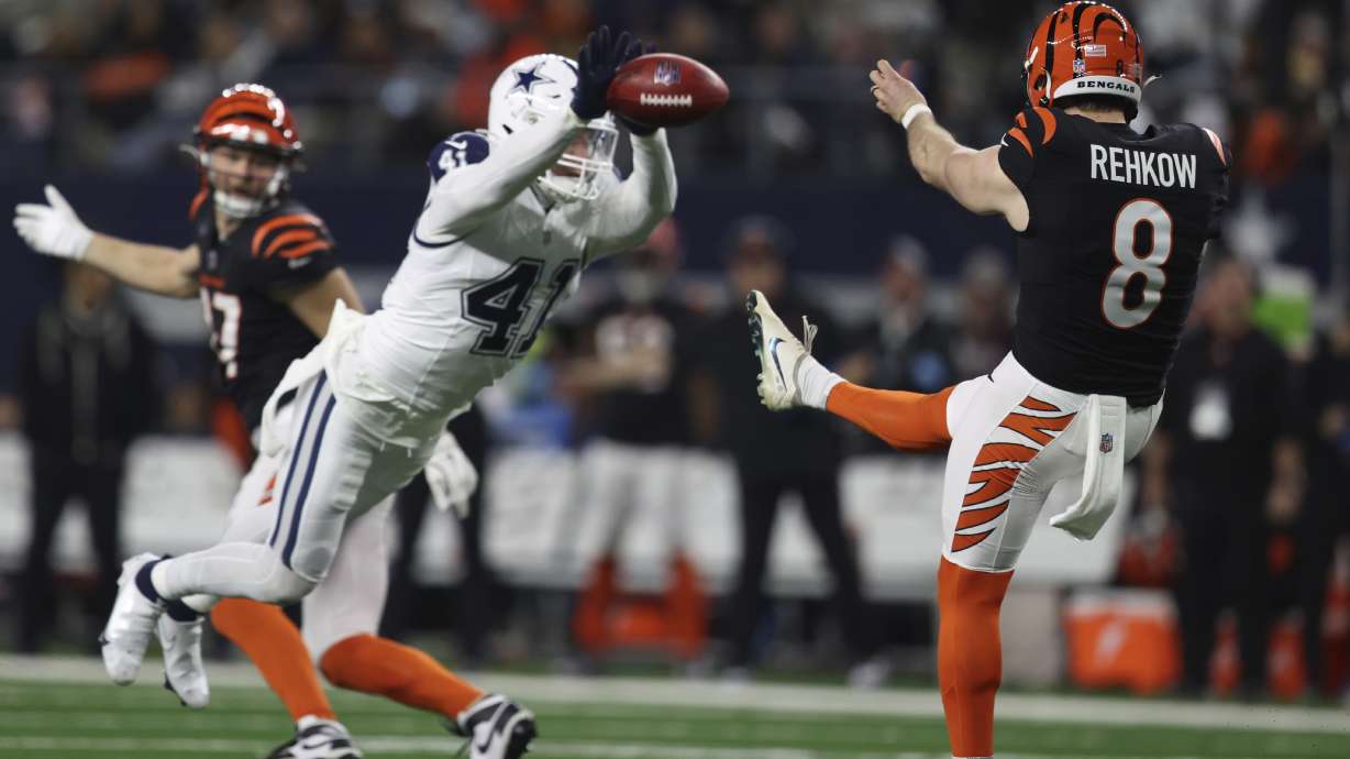 Dallas Cowboys linebacker Nick Vigil (41) blocks a punt by Cincinnati Bengals punter Ryan Rehkow (8) during the second half of an NFL football game, Monday, Dec. 9, 2024, in Arlington, Texas.