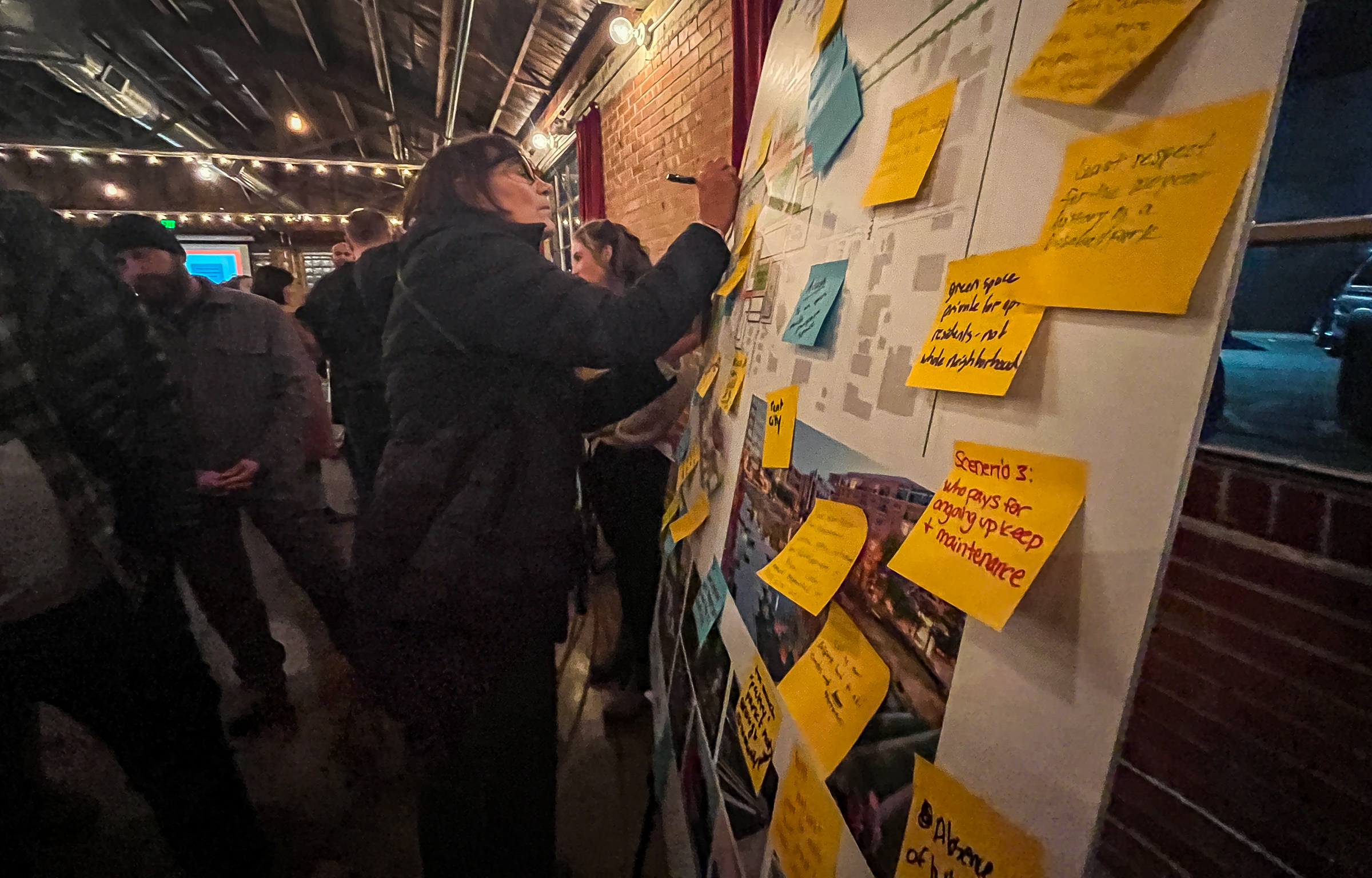 Residents and business owners near Smith's Ballpark leave feedback about Salt Lake City's three possible ballpark scenarios on sticky notes after a community meeting at Publik Coffee Roasters in Salt Lake City on Monday.