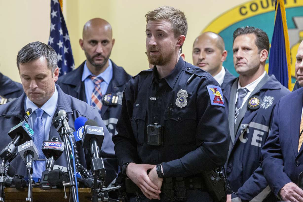 Altoona Police officer Tyler Frye, center, speaks during a press conference regarding the arrest of suspect Luigi Mangione, Monday, in Hollidaysburg, Pa., in the fatal shooting of UnitedHealthcare CEO Brian Thompson.
