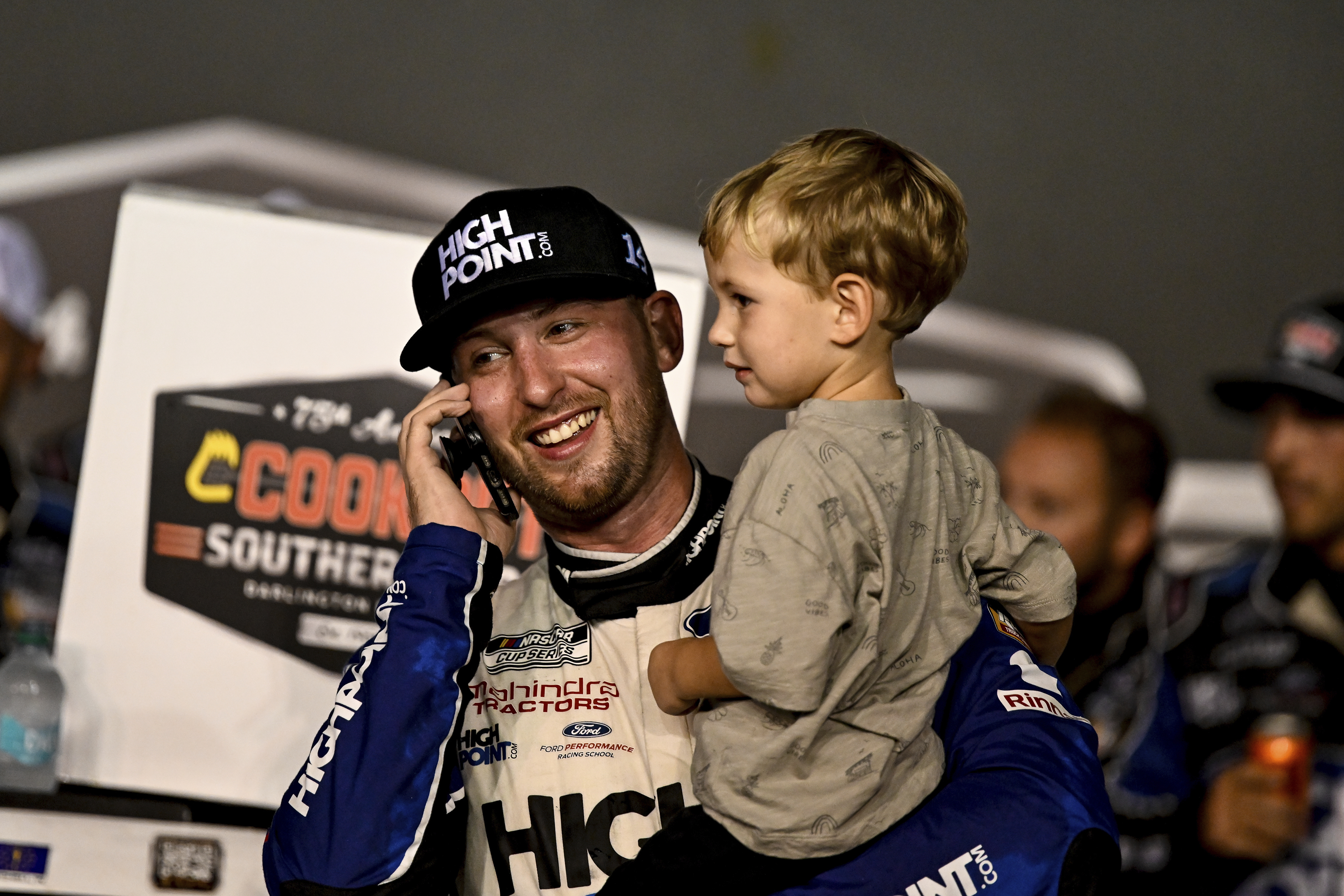 FILE - Chase Briscoe celebrates in Victory Lane with his son Brooks after winning a NASCAR Cup Series auto race at Darlington Raceway, Sept. 1, 2024, in Darlington, S.C.