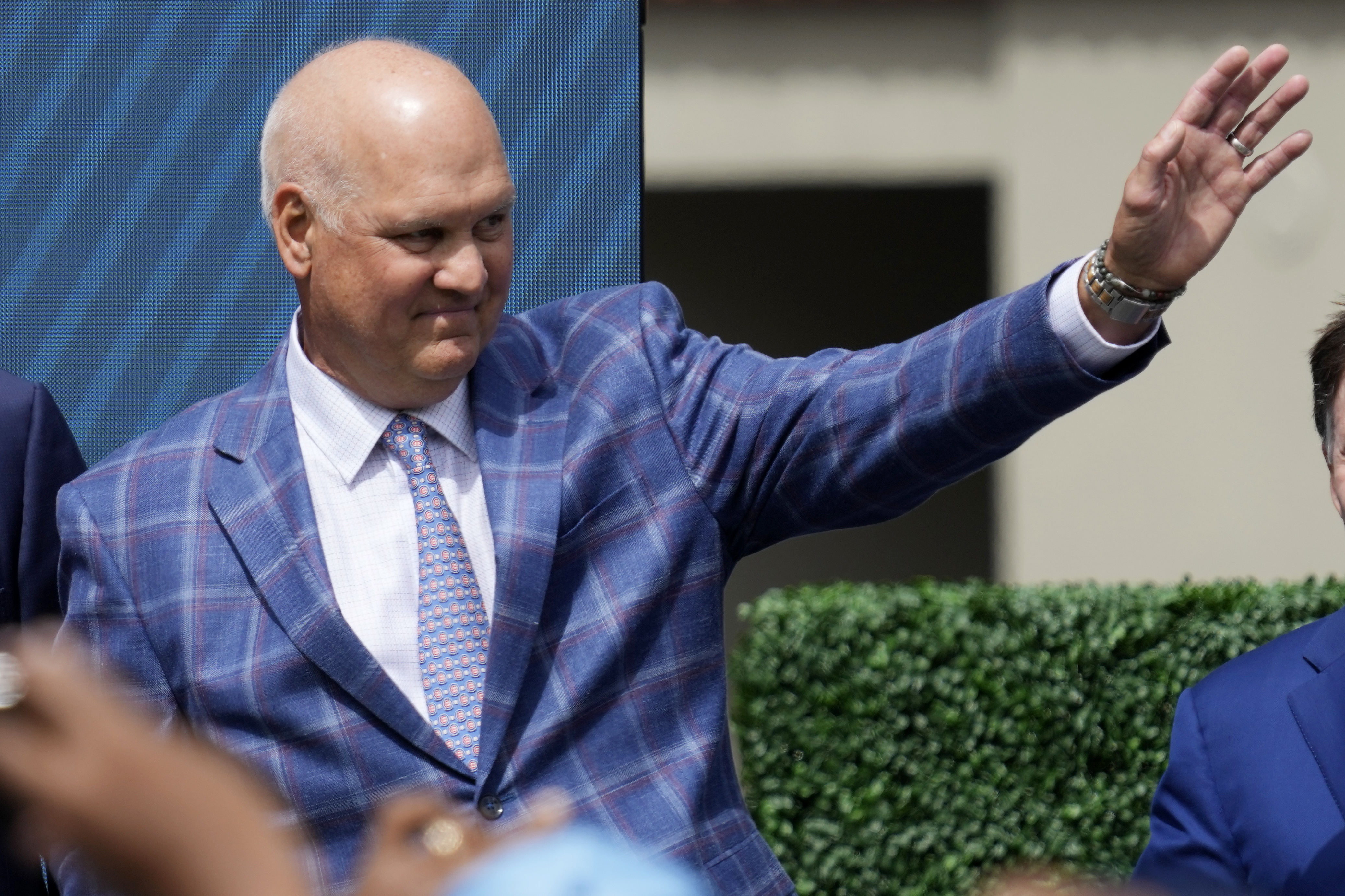 FILE - Former Chicago Cubs player Ryne Sandberg waves before the team unveils a statue of him before a baseball game against the New York Mets in Chicago, June 23, 2024.