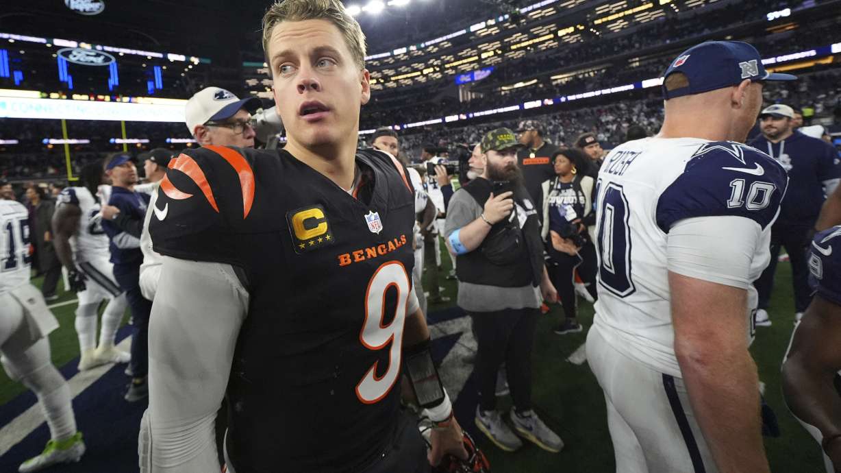 Cincinnati Bengals quarterback Joe Burrow (9) turns after greeting Dallas Cowboys quarterback Cooper Rush (10) after an NFL football game, Monday, Dec. 9, 2024, in Arlington, Texas.
