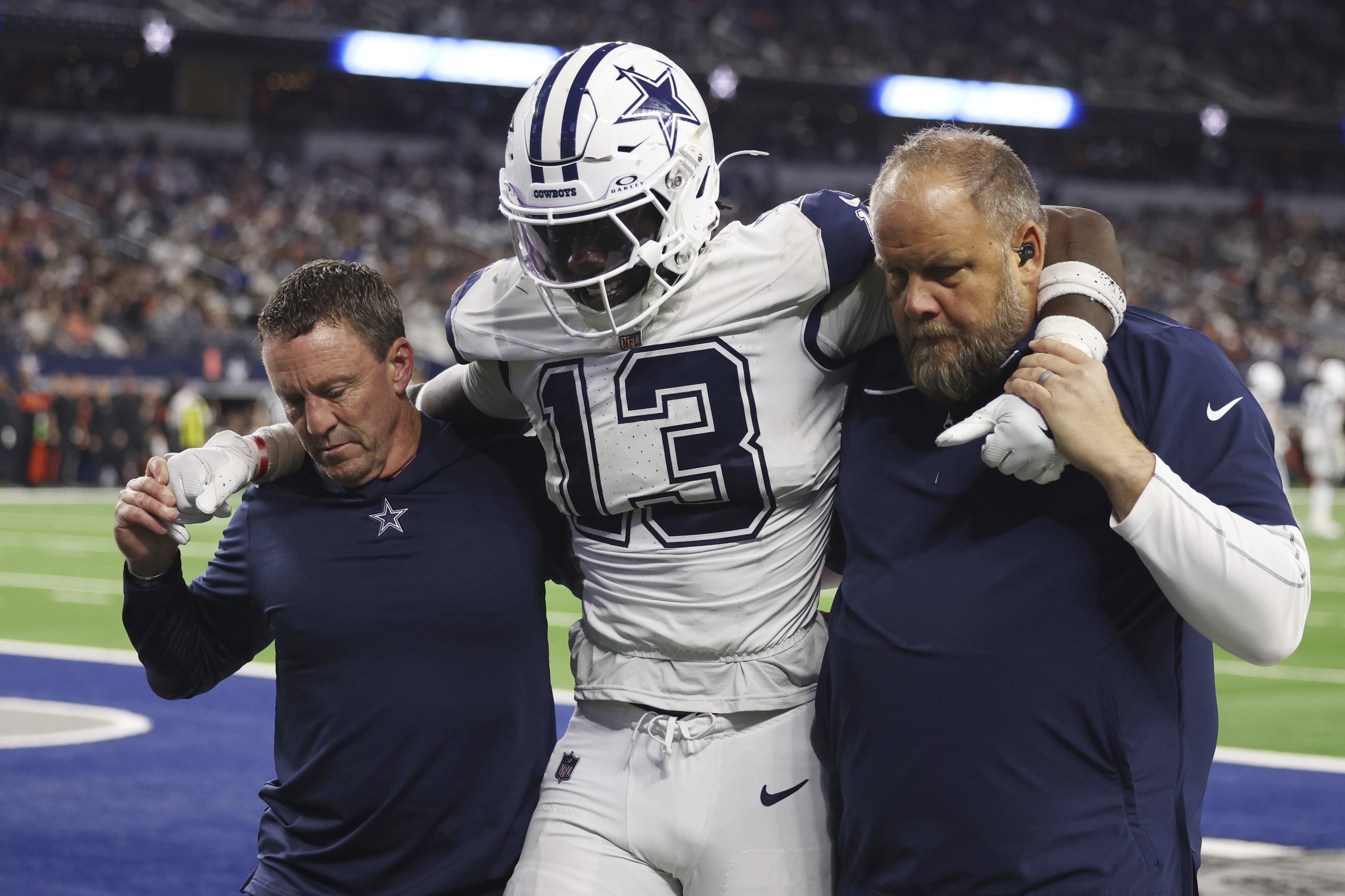 Dallas Cowboys linebacker DeMarvion Overshown is helped off the field after being injured during the second half of an NFL football game against the Cincinnati Bengals, Monday, Dec. 9, 2024, in Arlington, Texas.