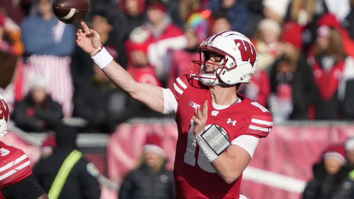 Wisconsin quarterback Braedyn Locke (18) throws a pass during the first half of an NCAA college football game against Minnesota Friday, Nov. 29, 2024, in Madison, Wis.