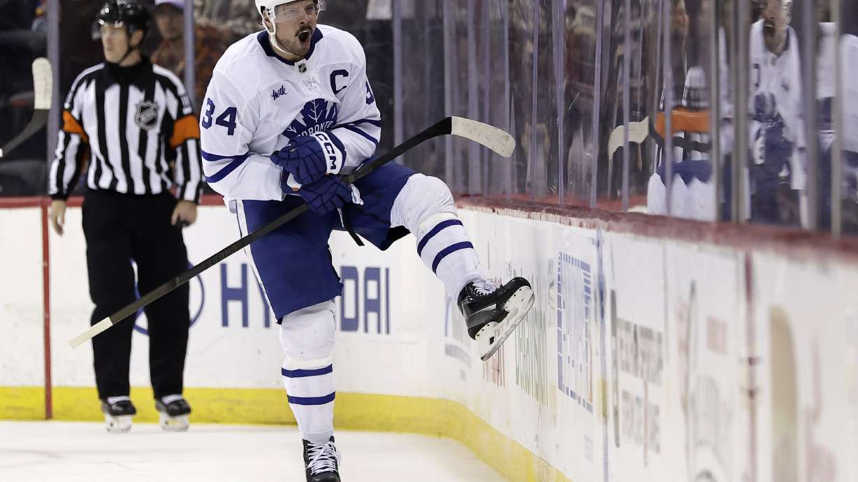Toronto Maple Leafs center Auston Matthews (34) reacts after scoring the game winning goal in a shootout of an NHL hockey game against the New Jersey Devils Tuesday, Dec. 10, 2024, in Newark, N.J. Toronto won 2-1.