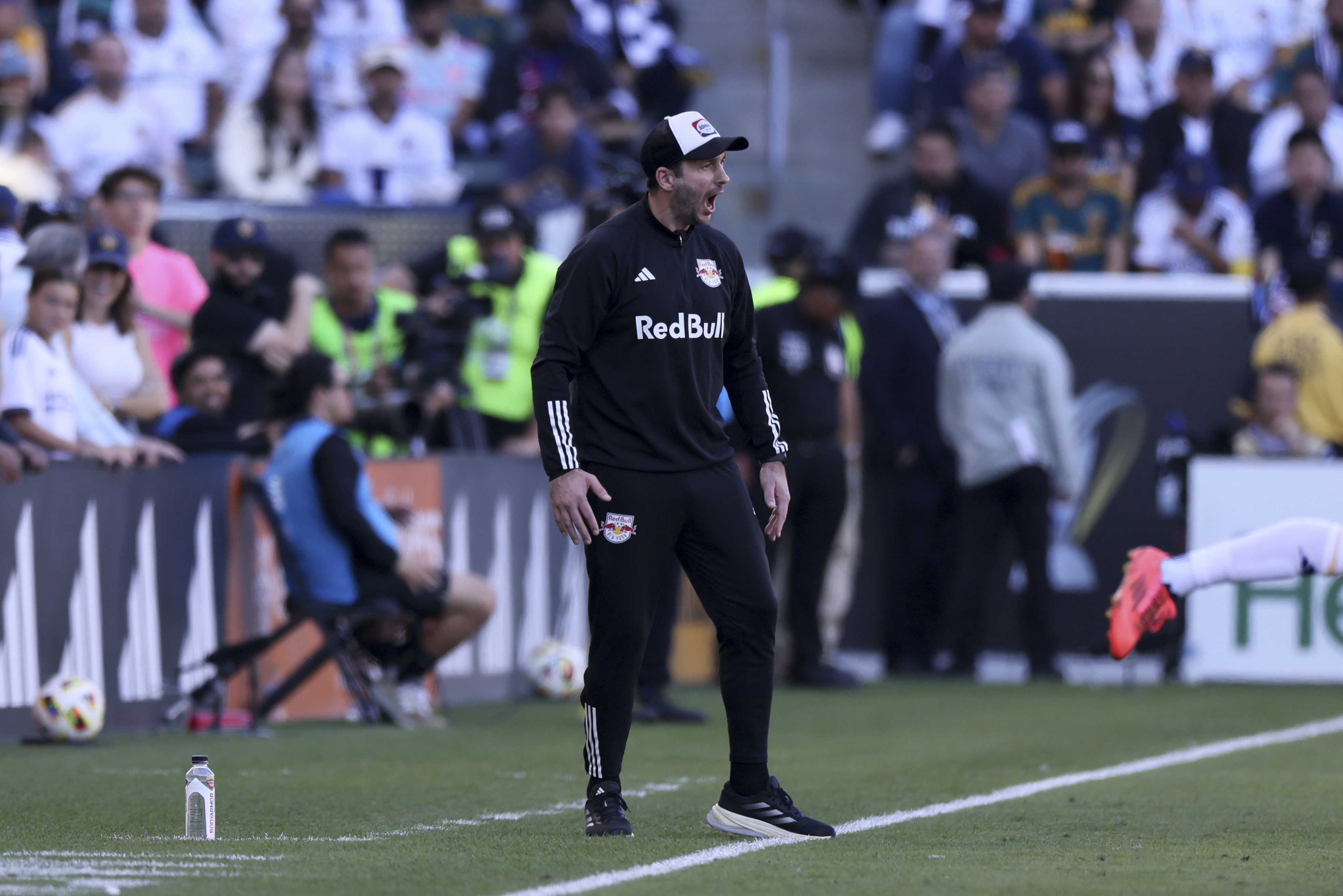 New York Red Bulls head coach Sandro Schwarz yells from the sideline during the second half of the MLS Cup championship soccer match against the Los Angeles Galaxy, Saturday, Dec. 7, 2024, in Carson, Calif.