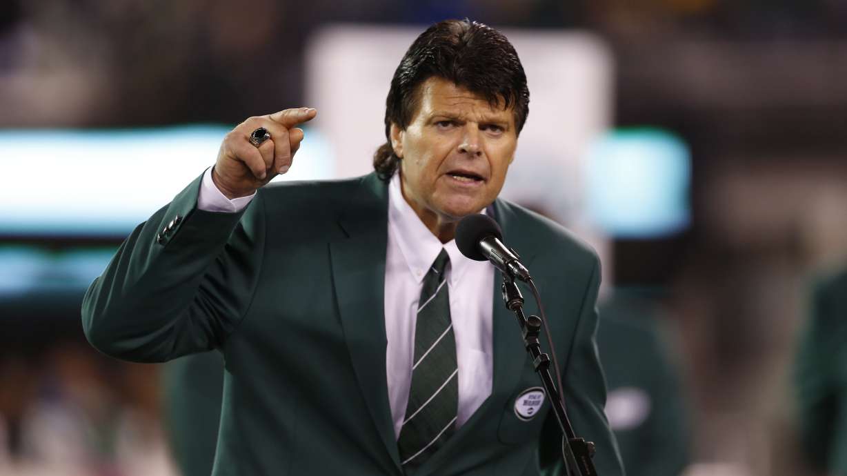 FILE - Former New York Jets defensive end Mark Gastineau gestures during the half time show of an NFL football game between the New York Jets and the Houston Texans Monday, Oct. 8, 2012, in East Rutherford, N.J.