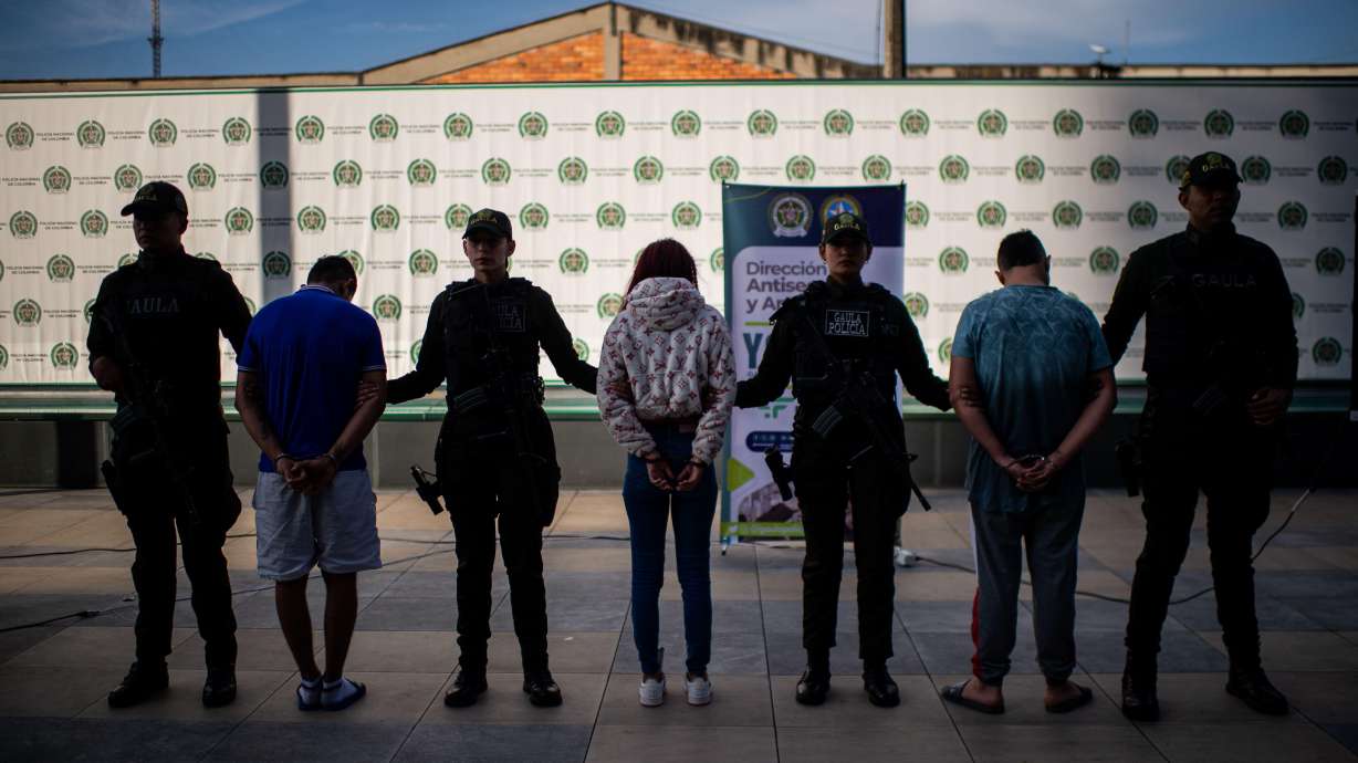 Colombia's anti-extortion police show three suspected members of the criminal gang Tren de Aragua after their capture in Bogota, Colombia. Utah officials say the gang, with roots in Venezuela, has a presence in the state.
