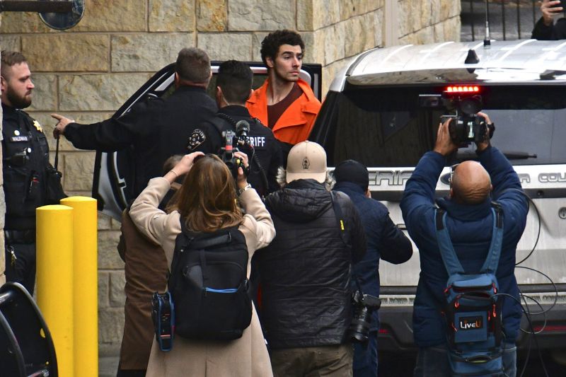 Suspect Luigi Mangione is taken into the Blair County Courthouse on Tuesday in Hollidaysburg, Pa.