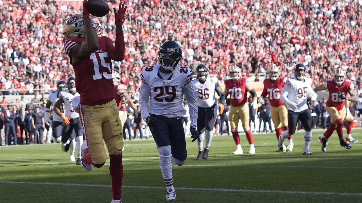 San Francisco 49ers wide receiver Jauan Jennings (15) catches a touchdown pass in front of Chicago Bears cornerback Tyrique Stevenson (29) during the first half of an NFL football game in Santa Clara, Calif., Sunday, Dec. 8, 2024.