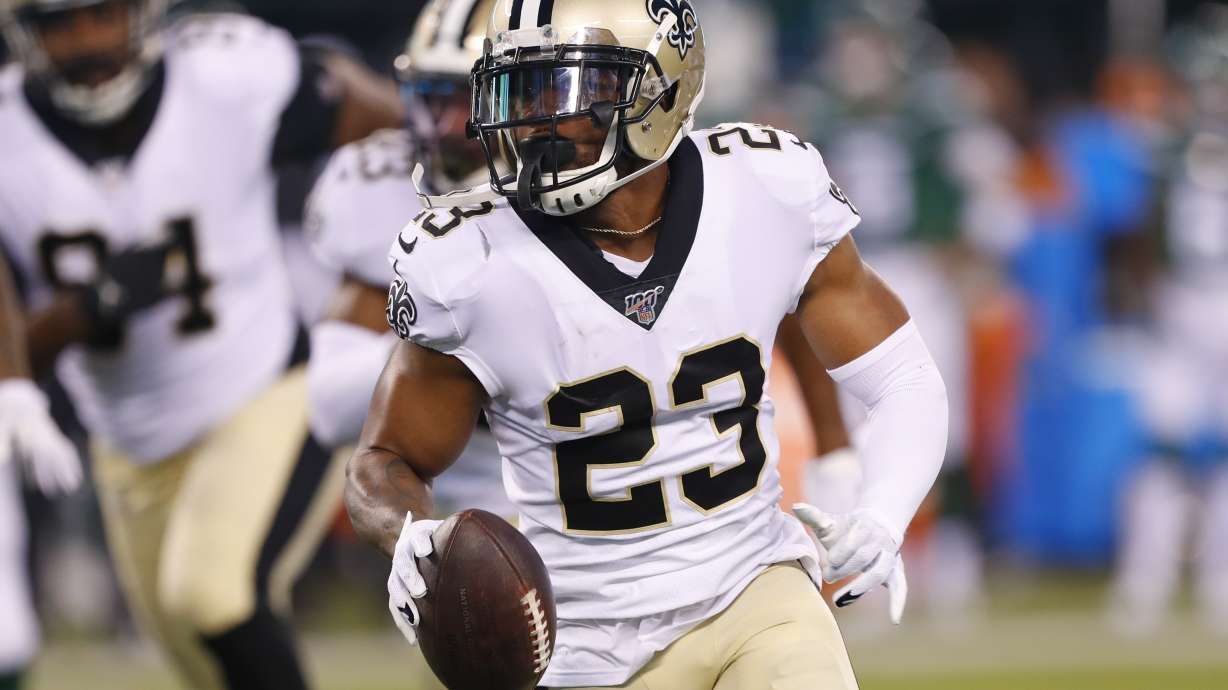 FILE - New Orleans Saints' Marshon Lattimore (23) runs back a fumble recovery during the first half of the team's preseason NFL football game against the New York Jets on Saturday, Aug. 24, 2019, in East Rutherford, N.J.