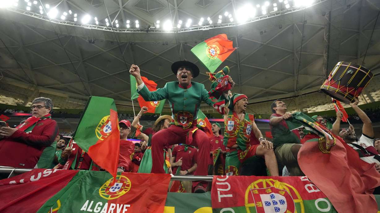 FILE - Portugal fans cheer before the World Cup quarterfinal soccer match between Morocco and Portugal, at Al Thumama Stadium in Doha, Qatar, Saturday, Dec. 10, 2022.