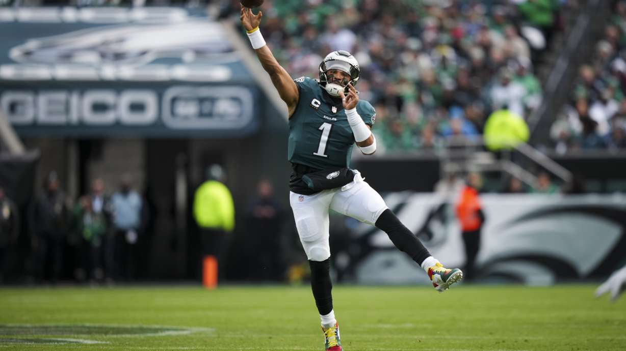 Philadelphia Eagles quarterback Jalen Hurts (1) passes during the first half of an NFL football game against the Carolina Panthers on Sunday, Dec. 8, 2024, in Philadelphia.