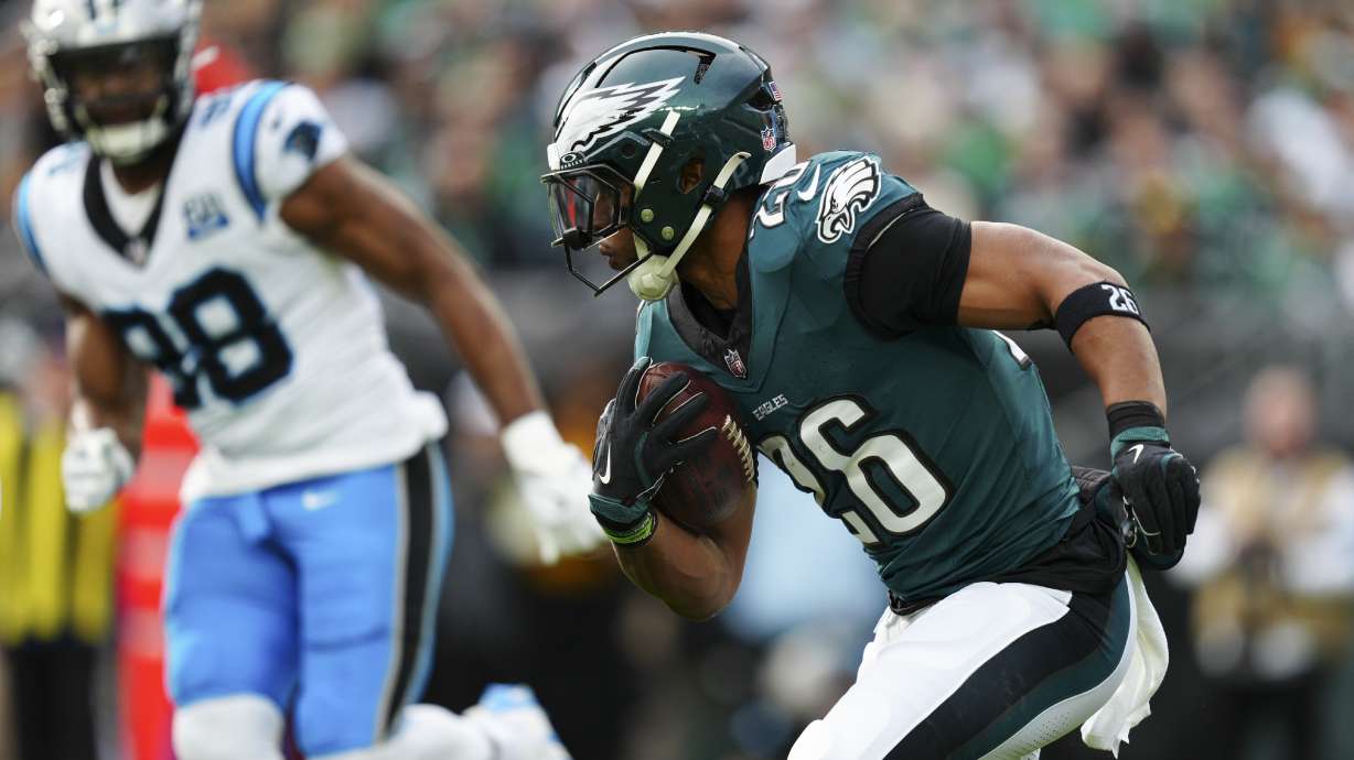 Philadelphia Eagles running back Saquon Barkley (26) runs with the ball during the first half of an NFL football game against the Carolina Panthers on Sunday, Dec. 8, 2024, in Philadelphia.