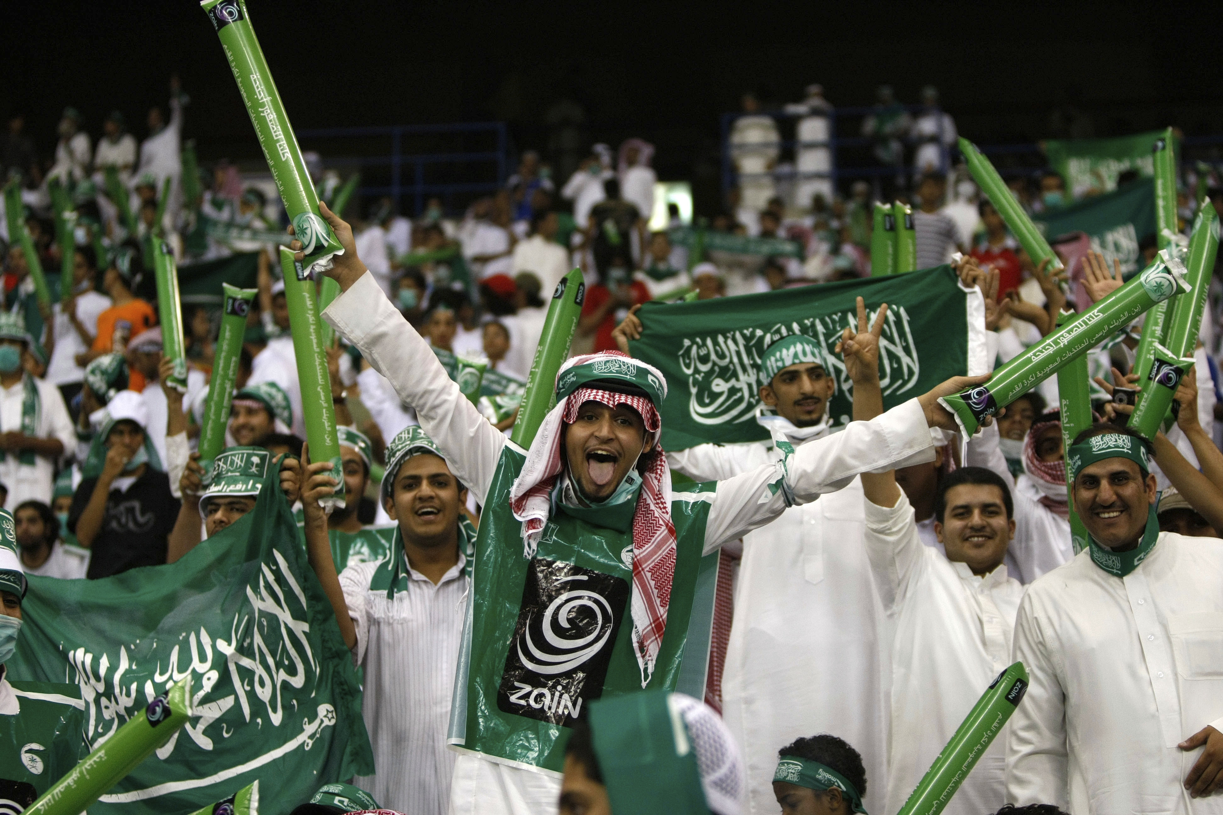 FILE - Saudi Arabian fans celebrate during a World Cup Asian qualifying playoff soccer match between Saudi Arabia and Bahrain at King Fahd Stadium in Riyadh, Saudi Arabia, Wednesday, Sept. 9, 2009.