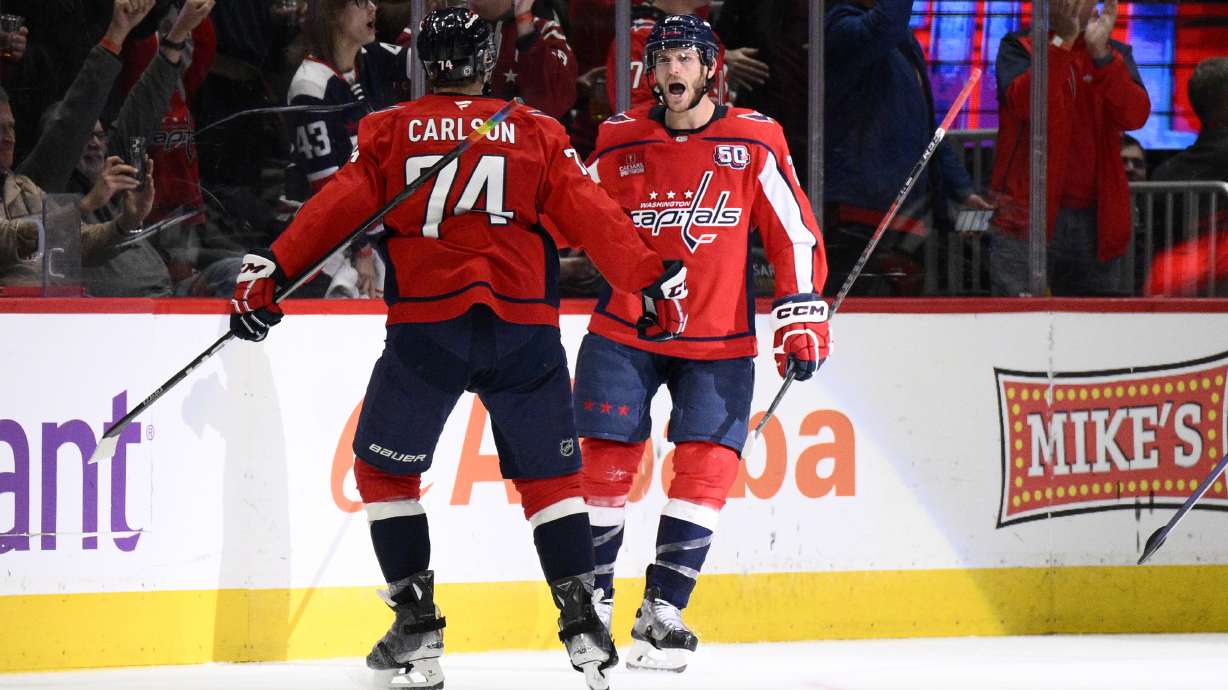 Washington Capitals center Nic Dowd, right, celebrates his goal with defenseman John Carlson (74) during the second period of an NHL hockey game against the San Jose Sharks, Tuesday, Dec. 3, 2024, in Washington.