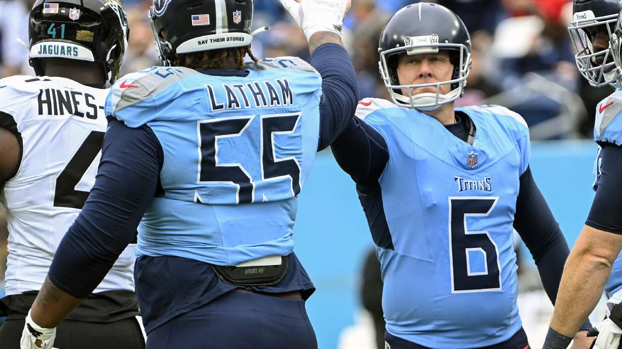 Tennessee Titans place kicker Nick Folk (6) celebrates a field goal against the Jacksonville Jaguars with teammate offensive tackle JC Latham (55) during the first half of an NFL football game, Sunday, Dec. 8, 2024, in Nashville, Tenn.