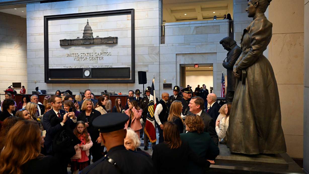Crowds gather around the Martha Hughes Cannon statue for pictures after it was installed at dedication ceremony in Emancipation Hall at the U.S. Capitol on Wednesday in Washington, D.C.