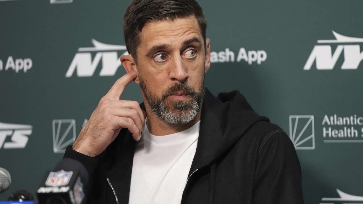 New York Jets quarterback Aaron Rodgers speaks during a news conference following an NFL football game against the Miami Dolphins, Sunday, Dec. 8, 2024, in Miami Gardens, Fla.