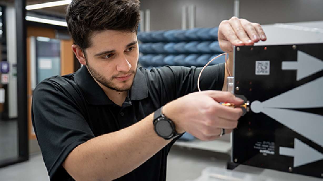Weber State University graduate student Gavin Messerly works on a ground-penetrating radar unit. Messerly is developing a technology that appeals to both military personnel and researchers studying the Great Salt Lake.