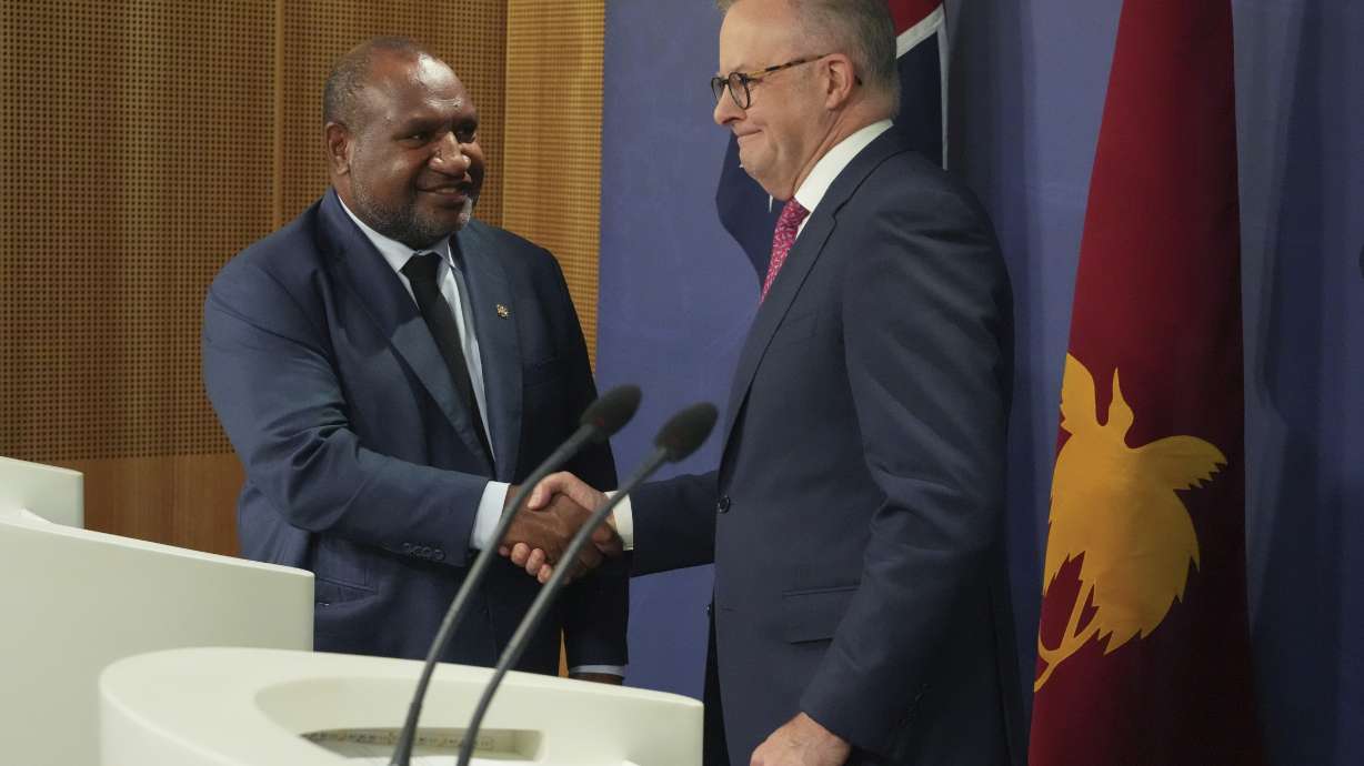 Australian Prime Minister Anthony Albanese, right, shakes hands with Papua New Guinea Prime Minister James Marape at a press conference in Sydney, Australia, Thursday, Dec. 12, 2024.