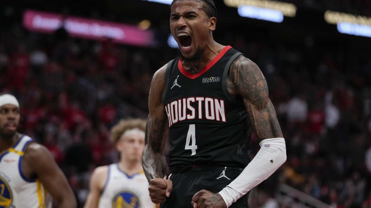 Houston Rockets guard Jalen Green celebrates after a dunk during the first half of an Emirates NBA cup tournament quarterfinal basketball game against the Golden State Warriors in Houston, Wednesday, Dec. 11, 2024.