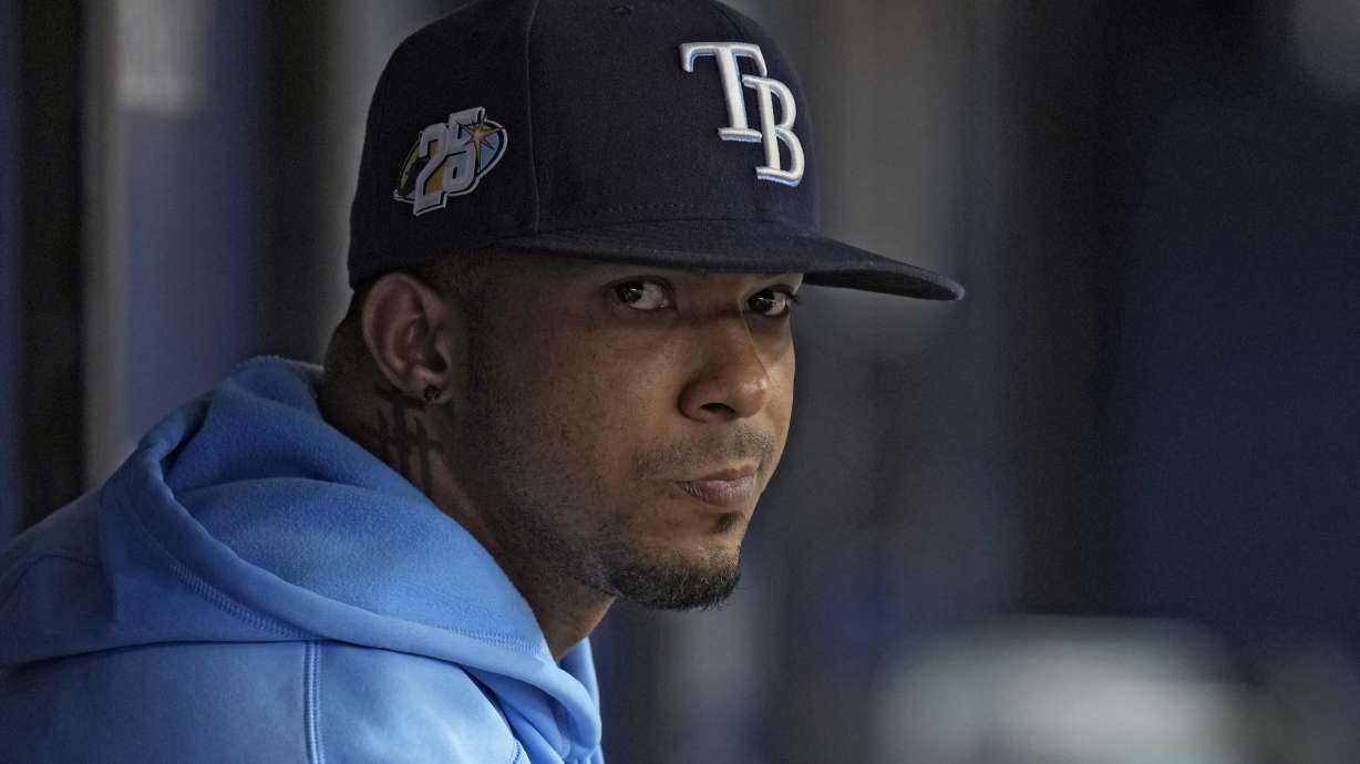 FILE - Tampa Bay Rays shortstop Wander Franco watches from the dugout during the fifth inning of a baseball game against the Cleveland Guardians, Aug. 13, 2023, in St. Petersburg, Fla.