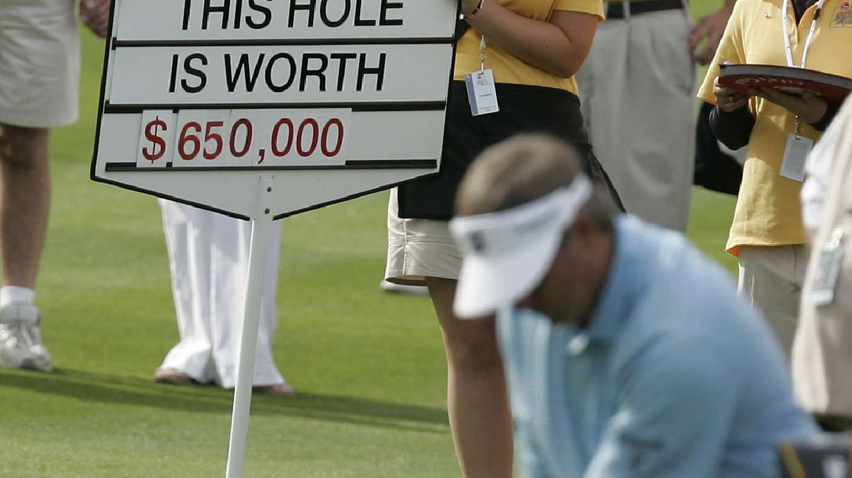 FILE - Fred Couples takes a practice swings in the 18th fairway, a hole worth US$650,000, during the Skins Game on the Celebrity course at Indian Wells Golf Resort in Indian Wells, Calif., Sunday, Nov. 25, 2007. Stephen Ames won the hole.