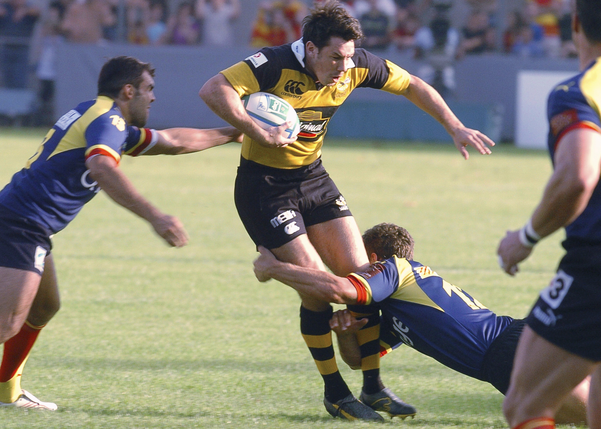 FILE - Tom Voyce of Wasps, center, is tackled by Perpignan's Gavin Hume, right, as Perpignan's David Marty looks on, left, during their European Rugby Cup match in Perpignan, southwestern France, Oct. 28 2006.