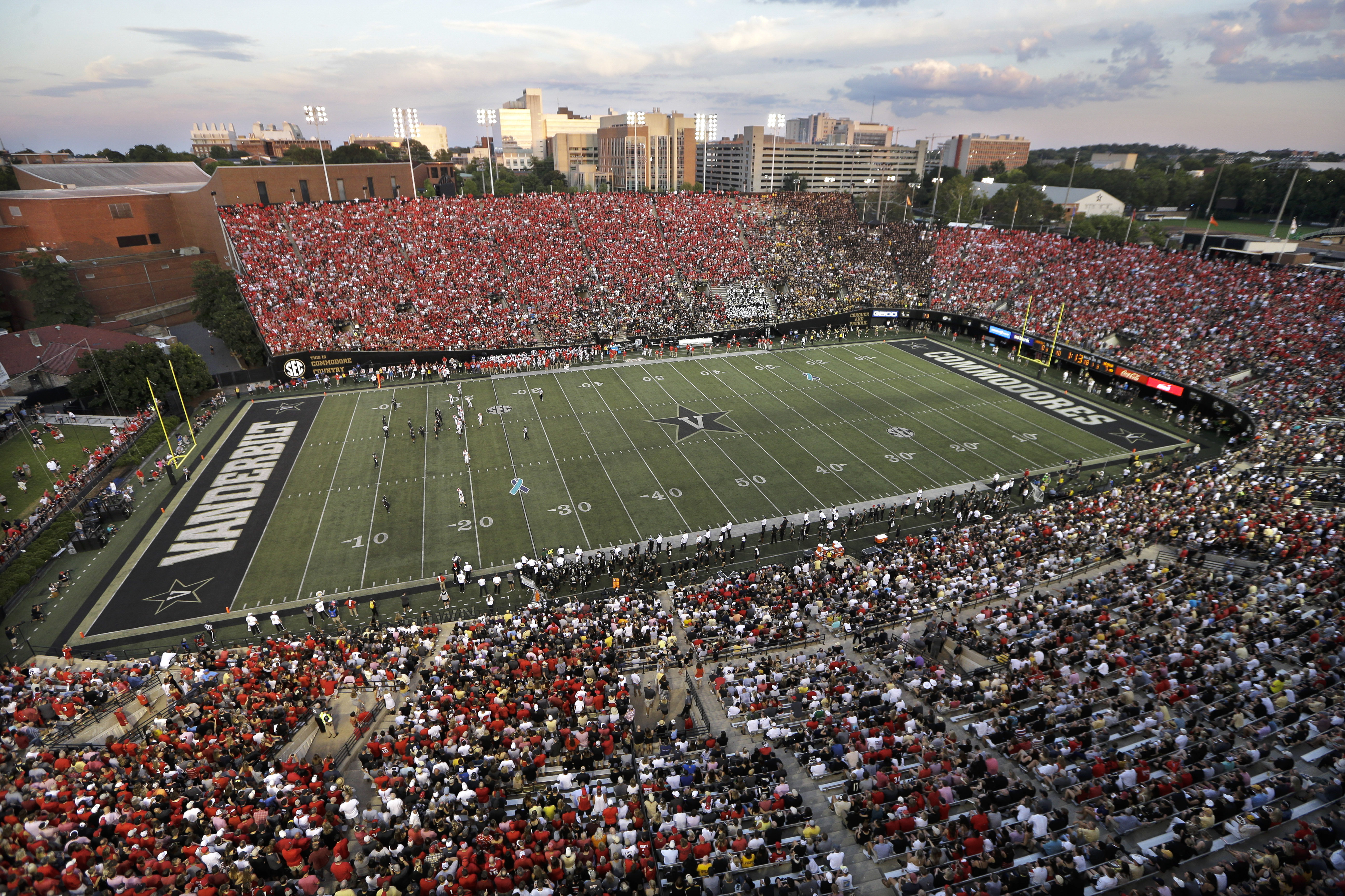 FILE - Georgia fans (wearing red) fill most of Vanderbilt Stadium in the first half of an NCAA college football game against Vanderbilt, Saturday, Aug. 31, 2019, in Nashville, Tenn.