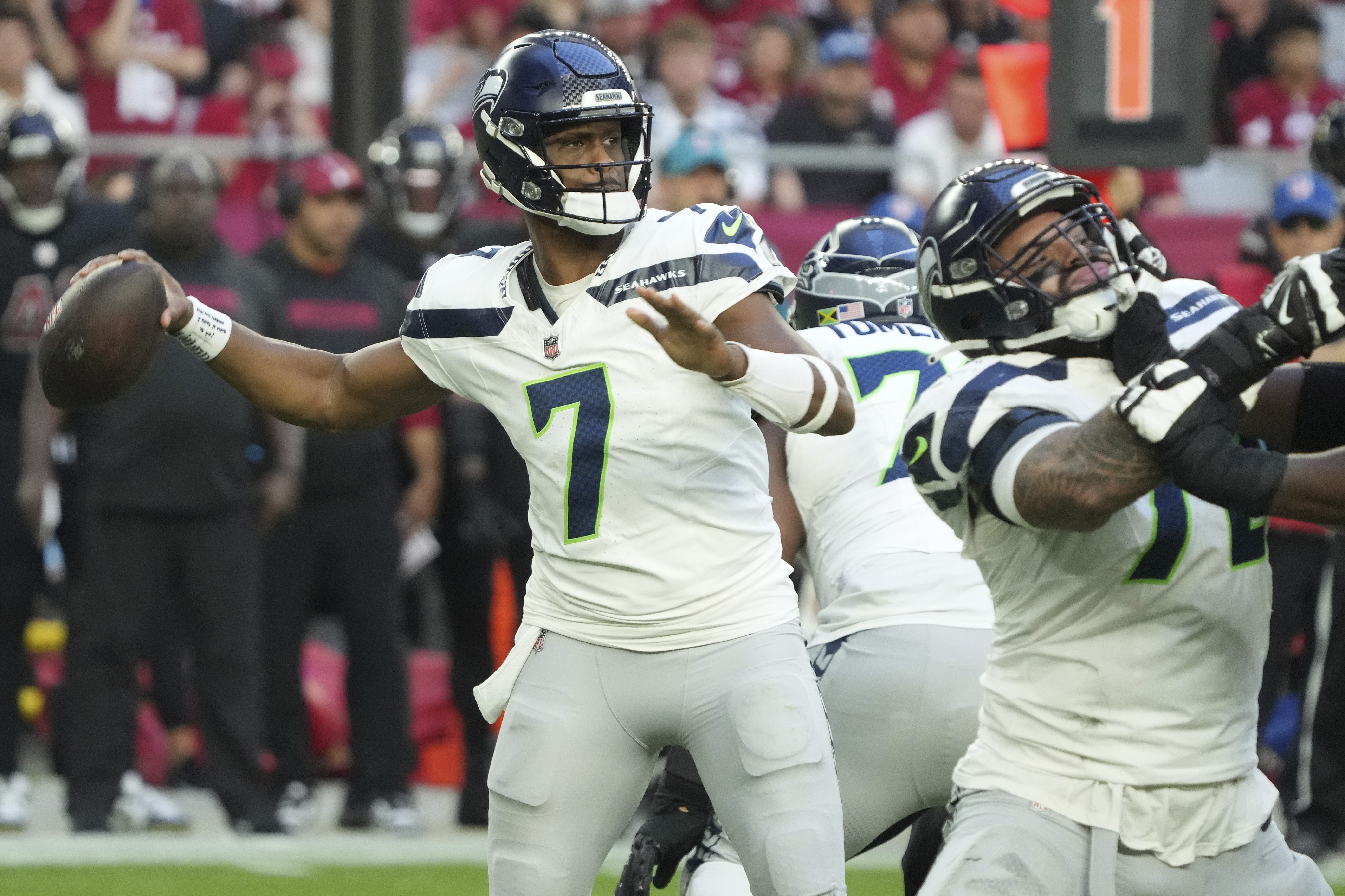 Seattle Seahawks quarterback Geno Smith (7) throws against the Arizona Cardinals during the second half of an NFL football game, Sunday, Dec. 8, 2024, in Glendale, Ariz.