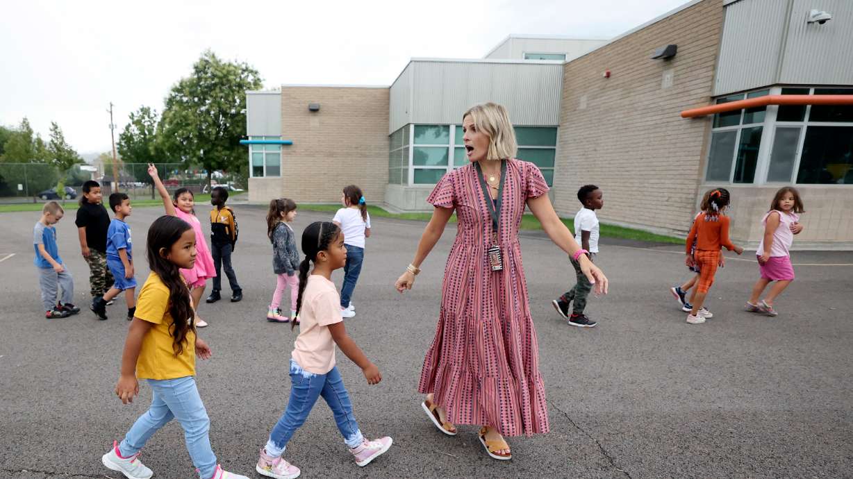 First-grade teacher Katelyn Bradley leads students back to class after recess at Mountain View Elementary School in Salt Lake City on Aug. 22, 2023. The new Utah Registered Apprenticeship Program for Teachers harnesses a competency-based pathway for aspiring educators to get their start in the field without a bachelor's degree.