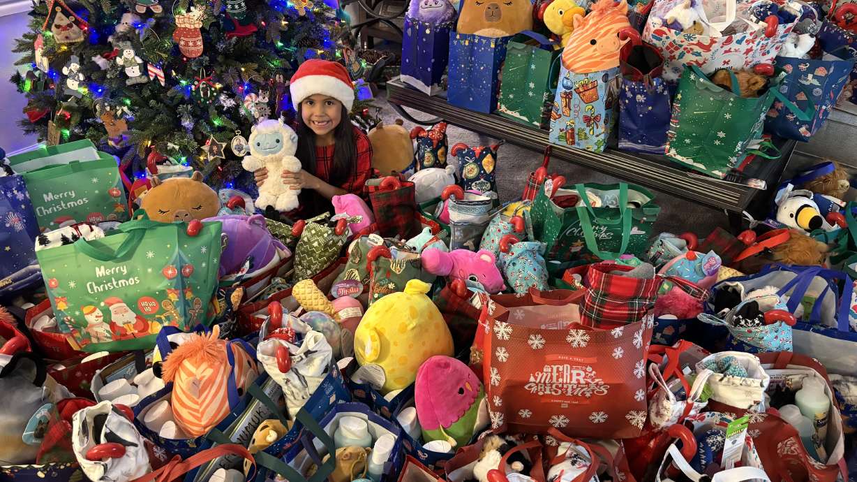 Chloe Montoya, center, sits amongst the bags she's prepared to give away to Native youth. She hopes this will allow them to share in the Christmas spirit. She made more than 100 bags to donate this holiday.