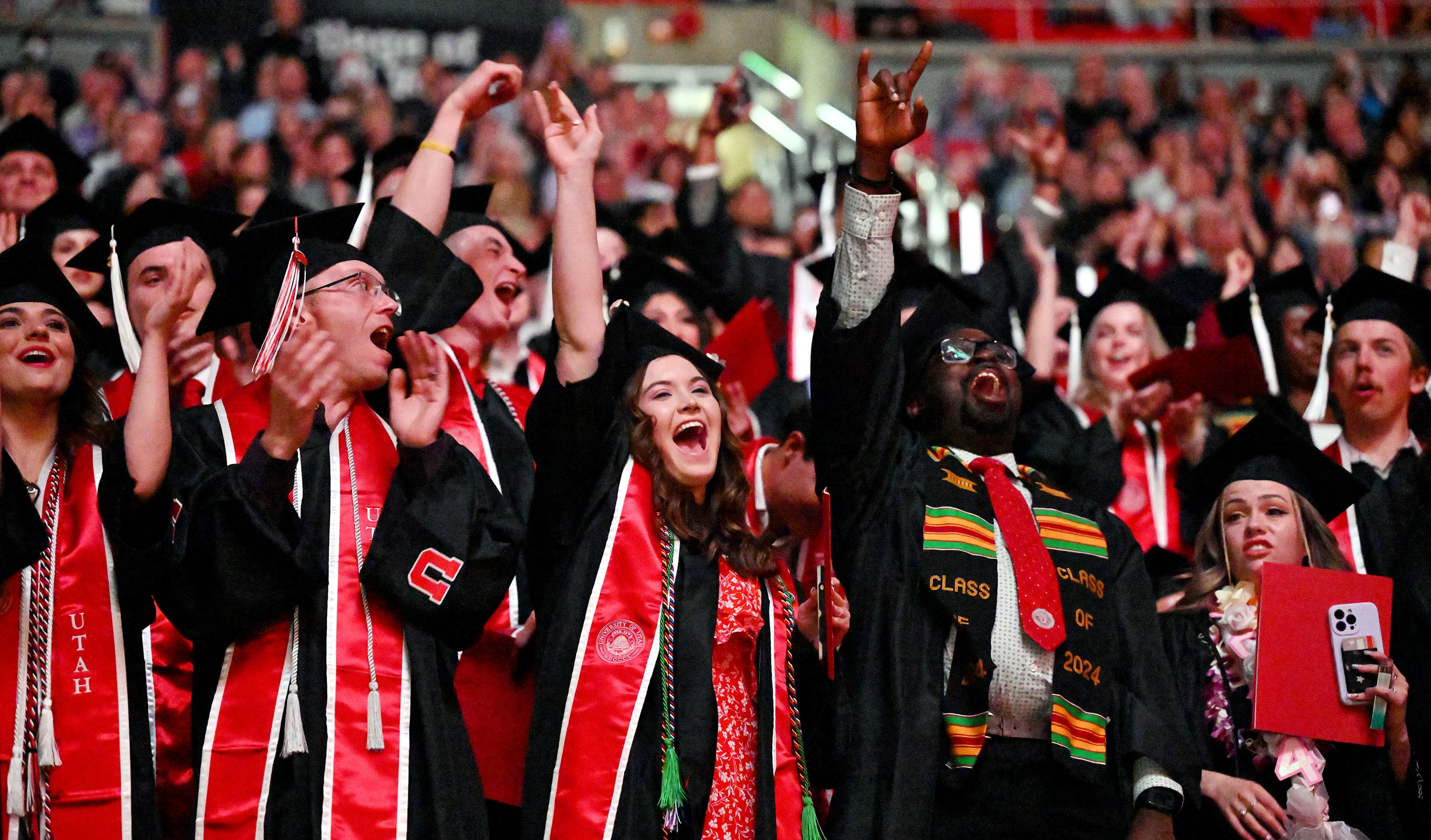 Graduates cheer as their group is introduced during commencement at the University of Utah in Salt Lake City on May 2.