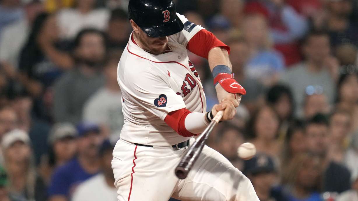 FILE - Boston Red Sox's Danny Jansen connects for an RBI single in the eighth inning of a baseball game against the Texas Rangers at Fenway Park, Aug. 14, 2024, in Boston.