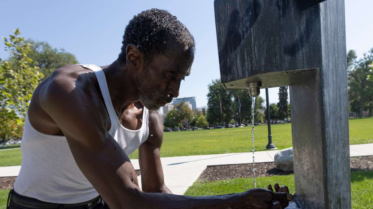 Dwight, who has been homeless for 10 years, washes his face in a fountain at Pioneer Park in Salt Lake City on Sept. 9. Utah lawmakers plan to prioritize recovery treatment over temporary shelter for chronic homelessness during the upcoming legislative session.