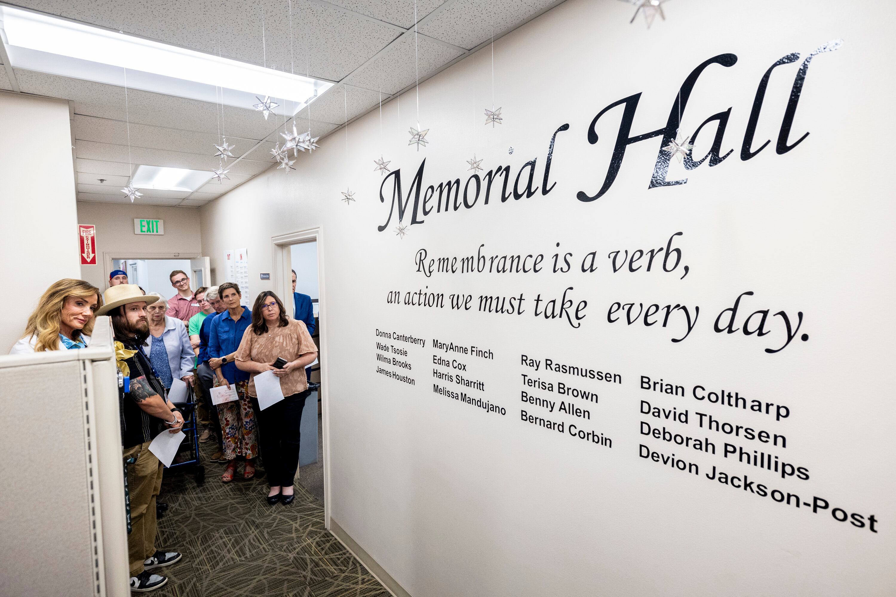 Community members listen to a musical number during a memorial event for deceased homeless people held at Community Action Services and Food Bank in Provo on Oct. 10.