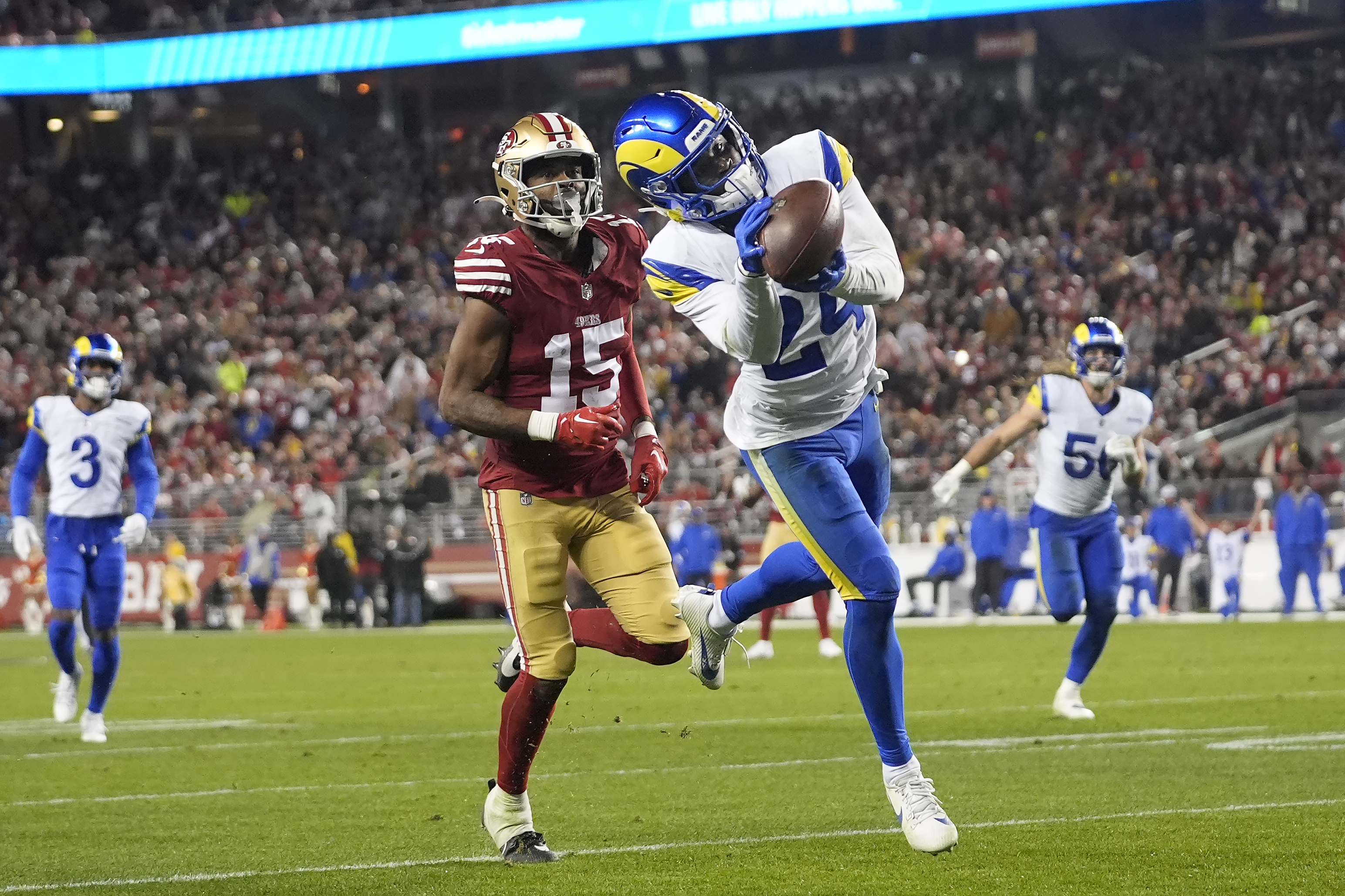 Los Angeles Rams cornerback Darious Williams (24) intercepts a pass in front of San Francisco 49ers wide receiver Jauan Jennings (15) during the second half of an NFL football game in Santa Clara, Calif., Thursday, Dec. 12, 2024.