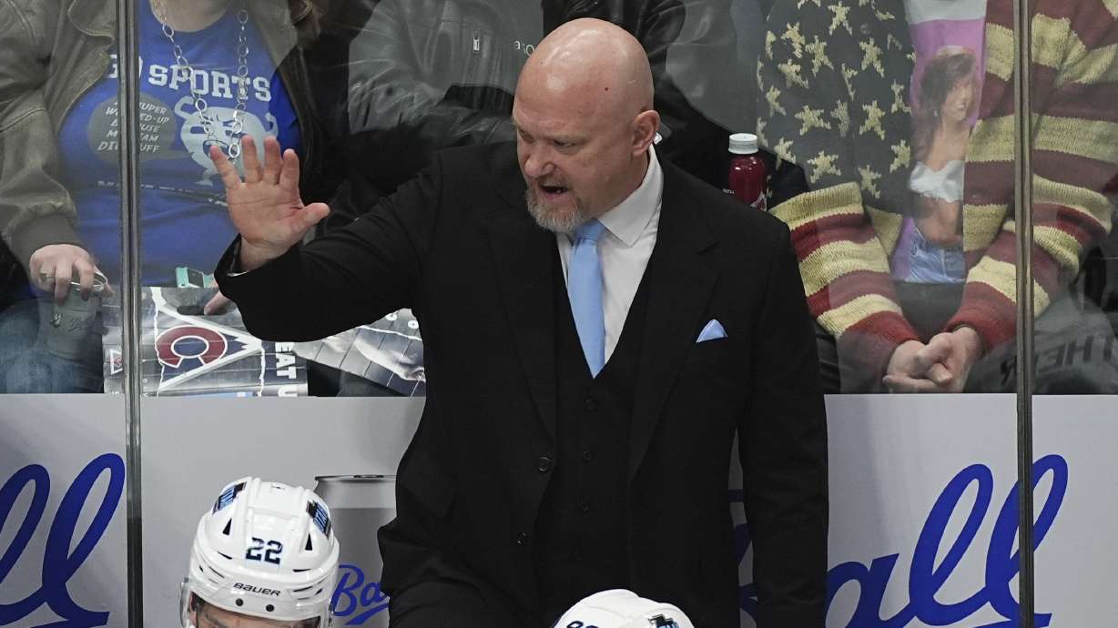 Utah Hockey Club head coach Andre Tourigny directs his team gainst the Colorado Avalanche in the first period of an NHL hockey game Thursday, Dec. 12, 2024, in Denver.