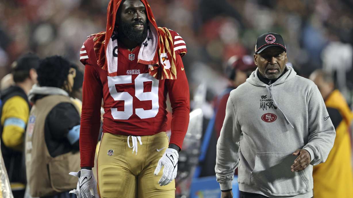 San Francisco 49ers' De'Vondre Campbell walks to the locker room during the second half of an NFL football game against the Los Angeles Rams in Santa Clara, Calif., Thursday, Dec. 12, 2024.