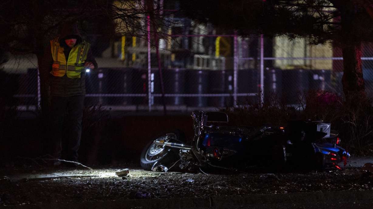 Police investigate the scene of a accident where a motorcycle left the roadway and struck a tree, and one male patient in his 40s was transported to the hospital in critical condition, in Midvale on Thursday.