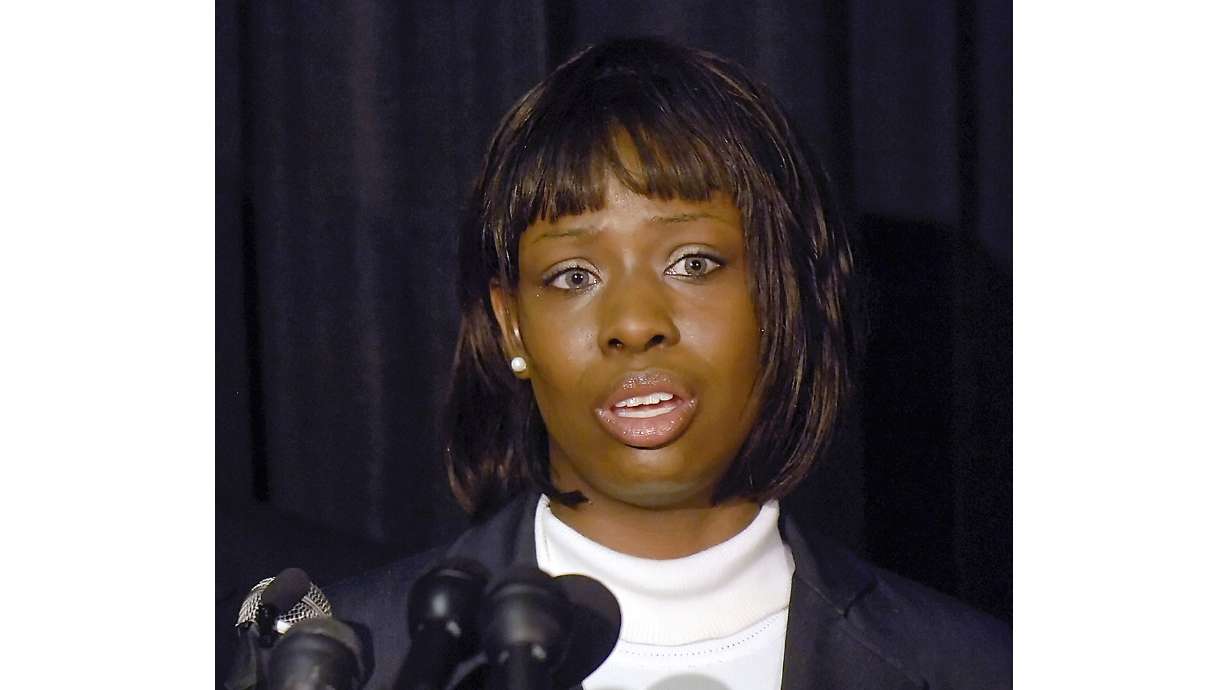 FILE - Crystal Mangum, who falsely accused Duke lacrosse players of rape, addresses the media during a news conference in Durham, N.C., on Oct. 23, 2008.