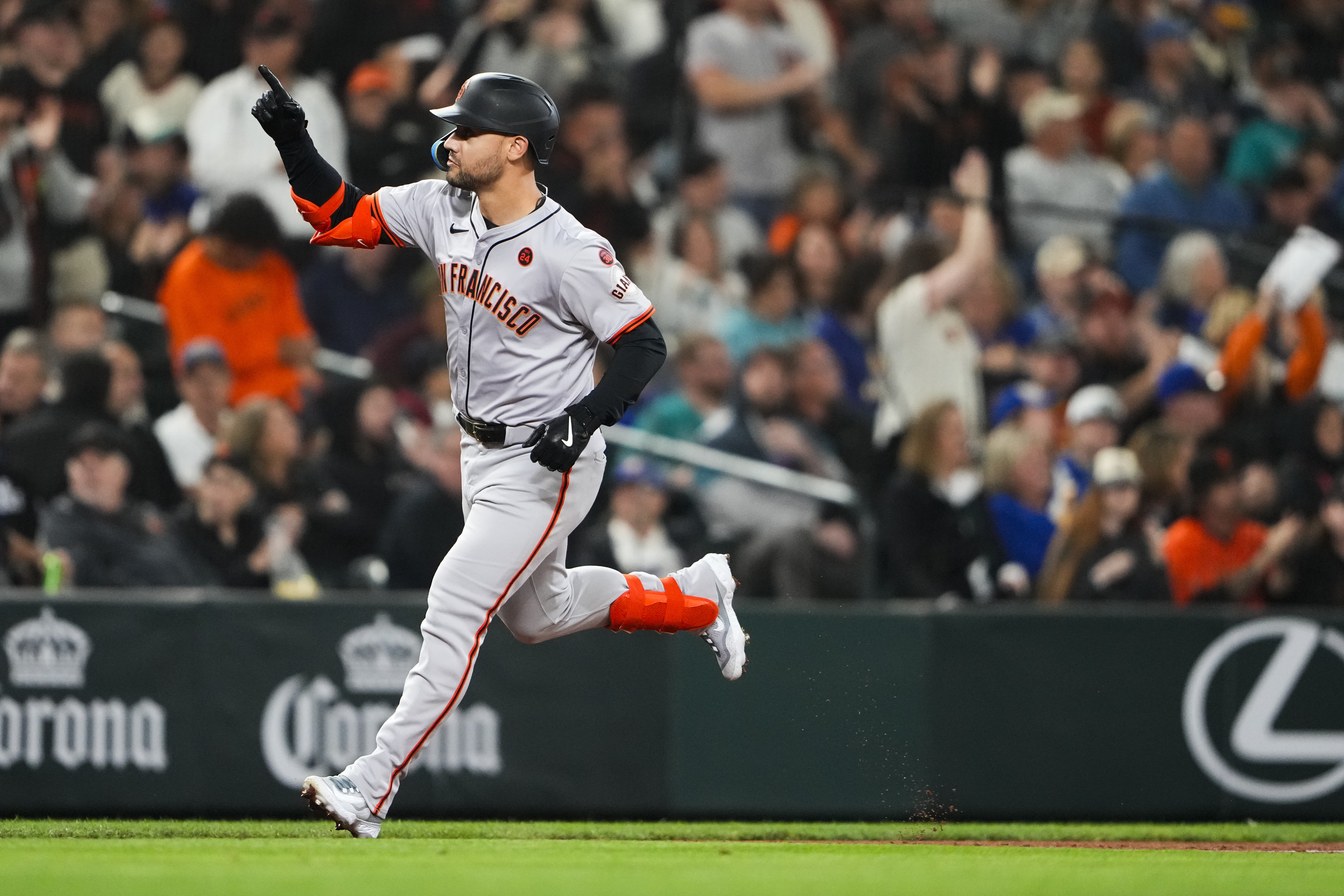 FILE - San Francisco Giants' Michael Conforto runs the bases after hitting a two-run home run to score Heliot Ramos against the Seattle Mariners during the fourth inning of a baseball game, Aug. 23, 2024, in Seattle.