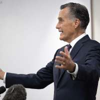 As Mitt Romney heads for the exit, he sounds a hopeful note on Trump