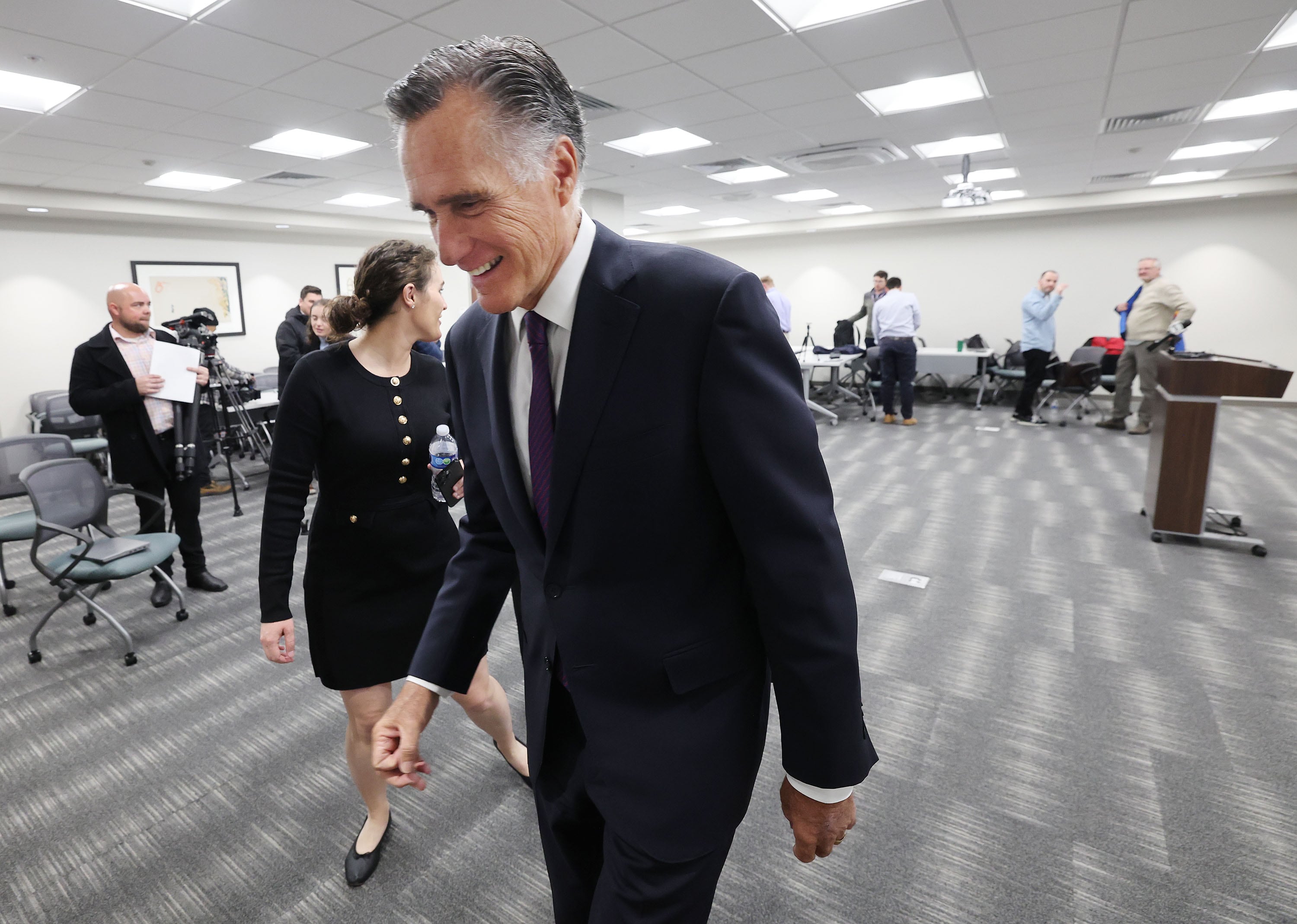 Sen. Mitt Romney, R-Utah, leaves his last press conference in Salt Lake City on Friday.