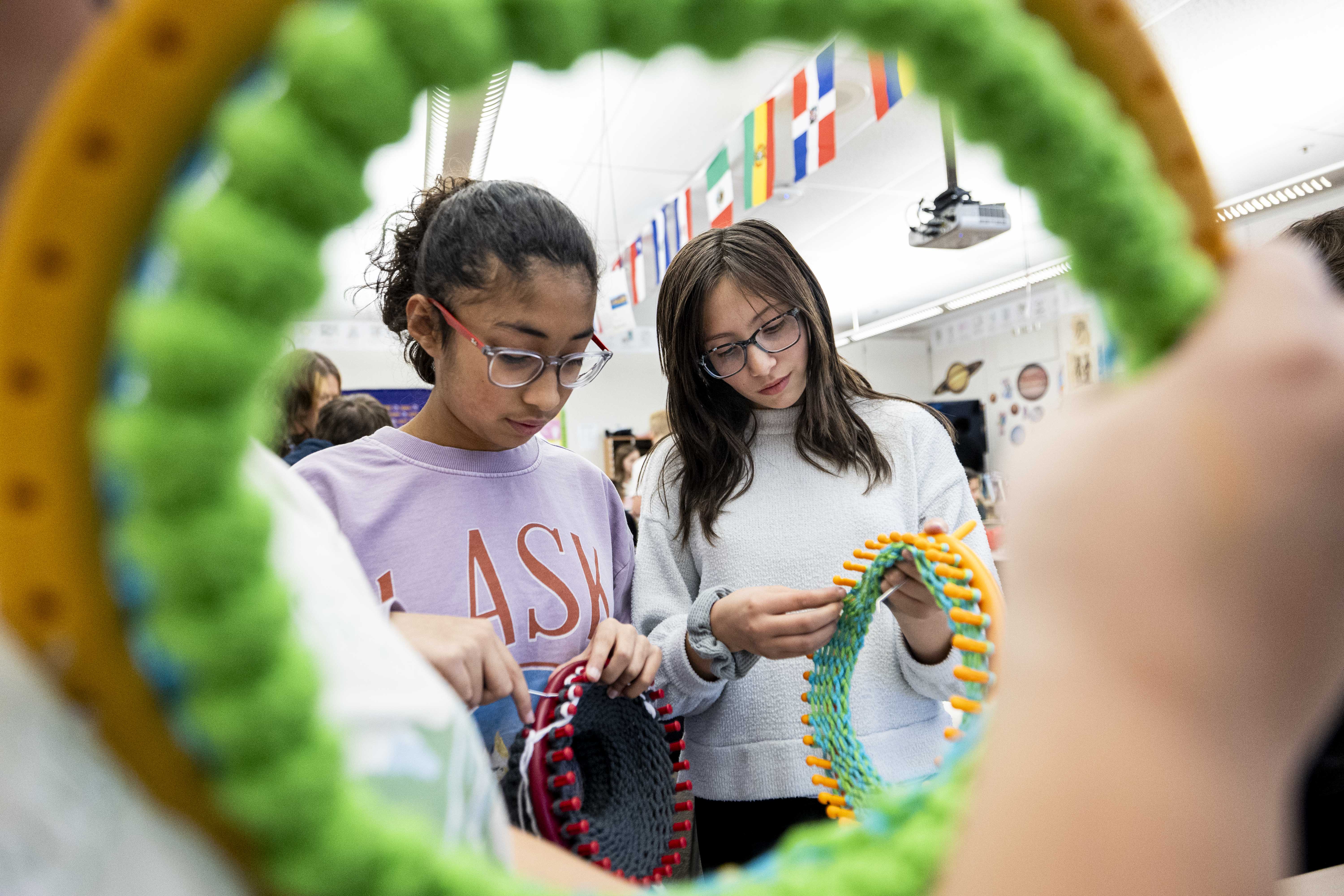 Farmington students volunteer to knit hats to help keep senior citizens in Ecuador warm 